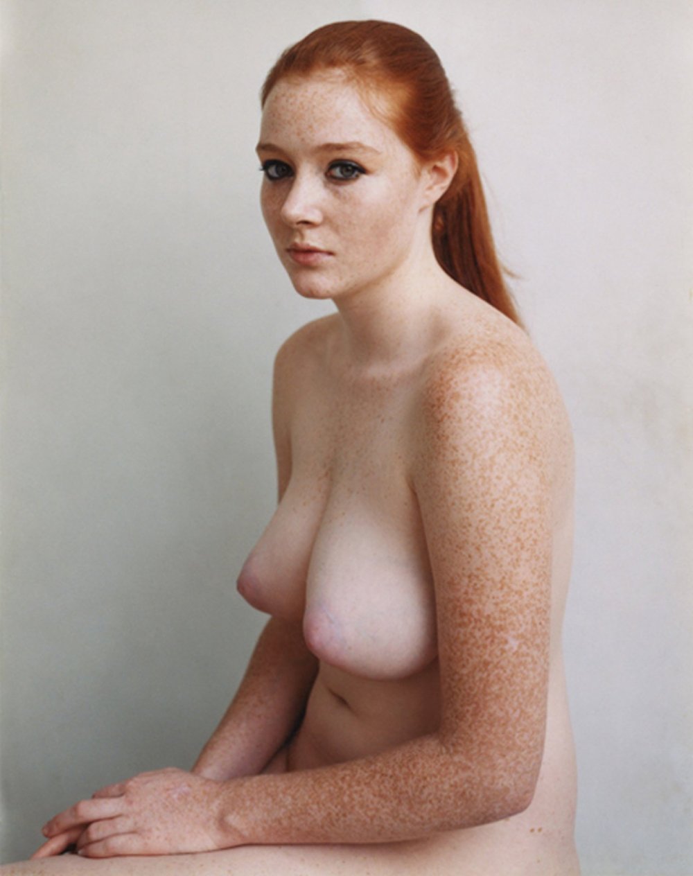 Redhead curly with big breasts
