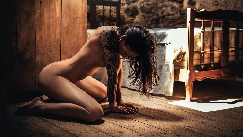 Poses for an erotic photo shoot