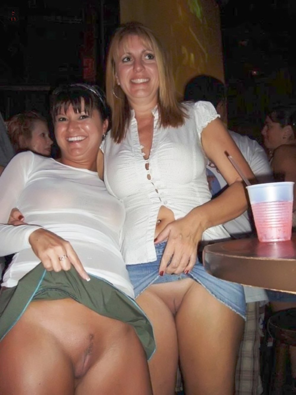 Women in shorts squatting
