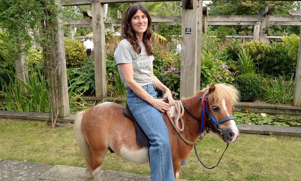 Women ride ponies and horses