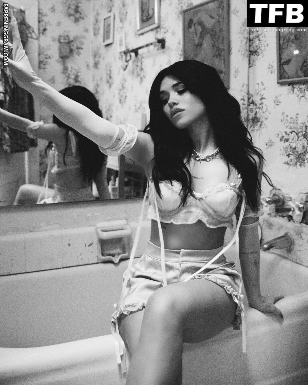 Nessa Barrett near the window