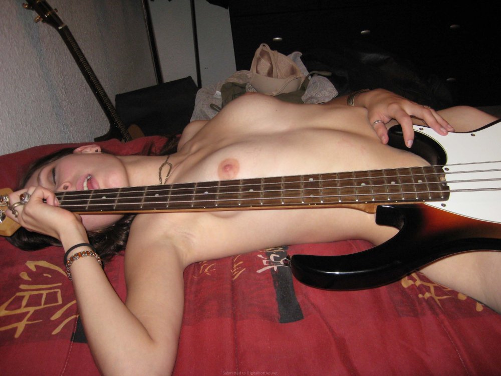 Brunette Naked with a guitar hairy