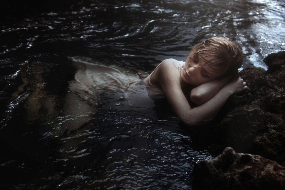 Girl in the water at night