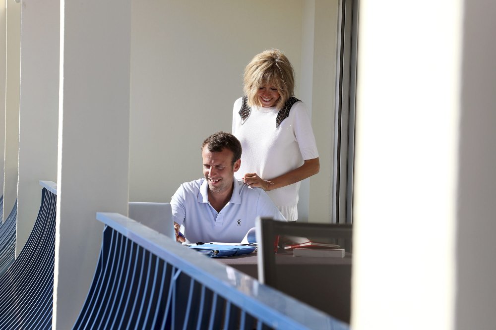 Macron with his wife on football