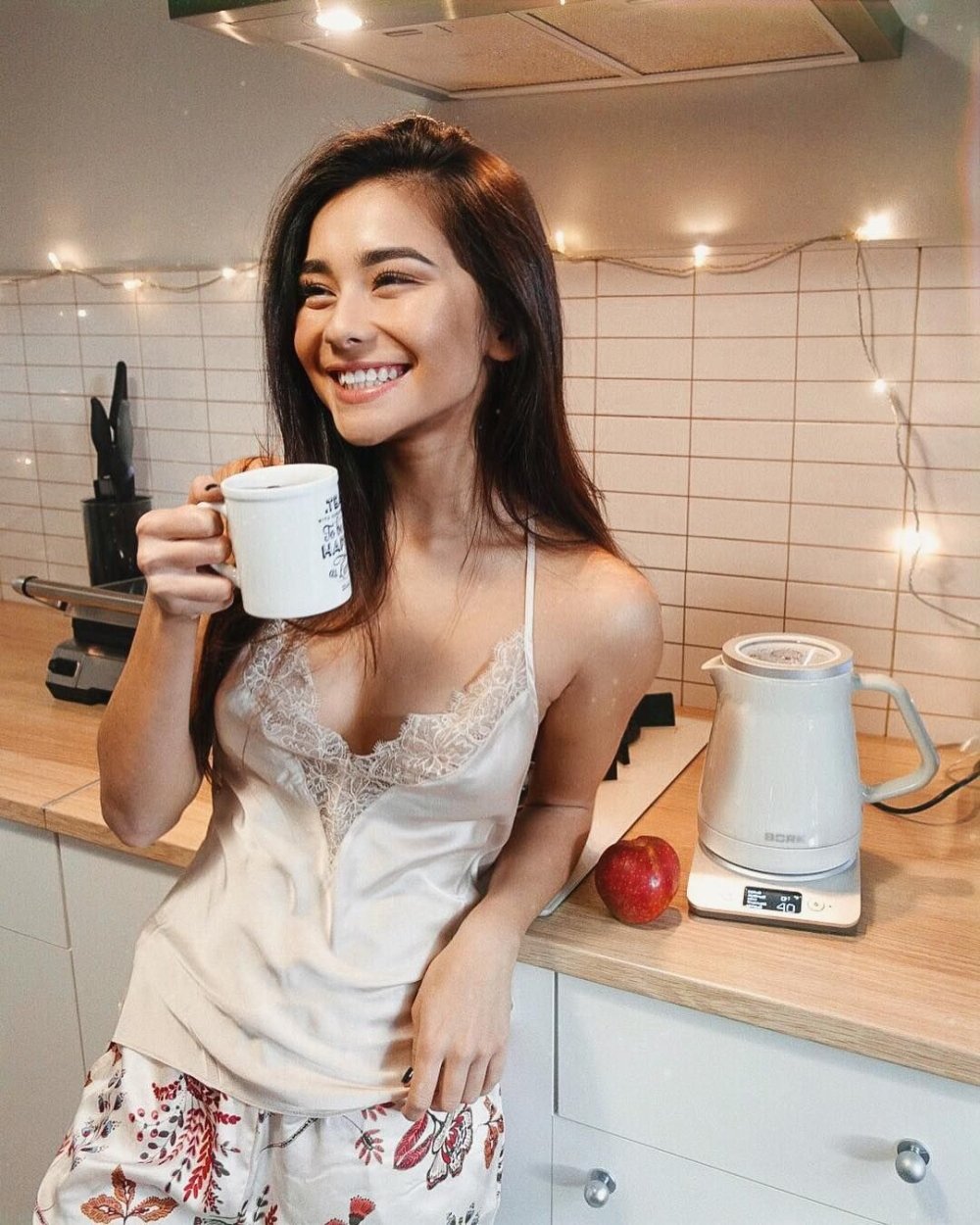 Diana Korkunova in the evening with a glass of coffee