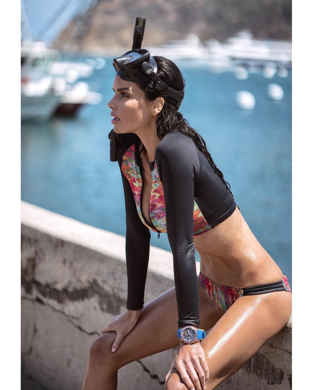 A woman in a swimsuit with fish and