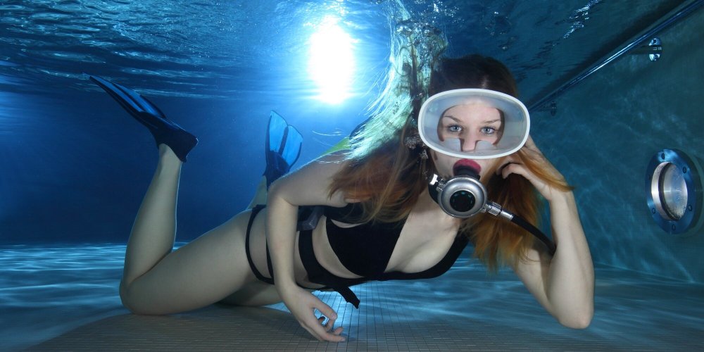 Girl in flippers underwater