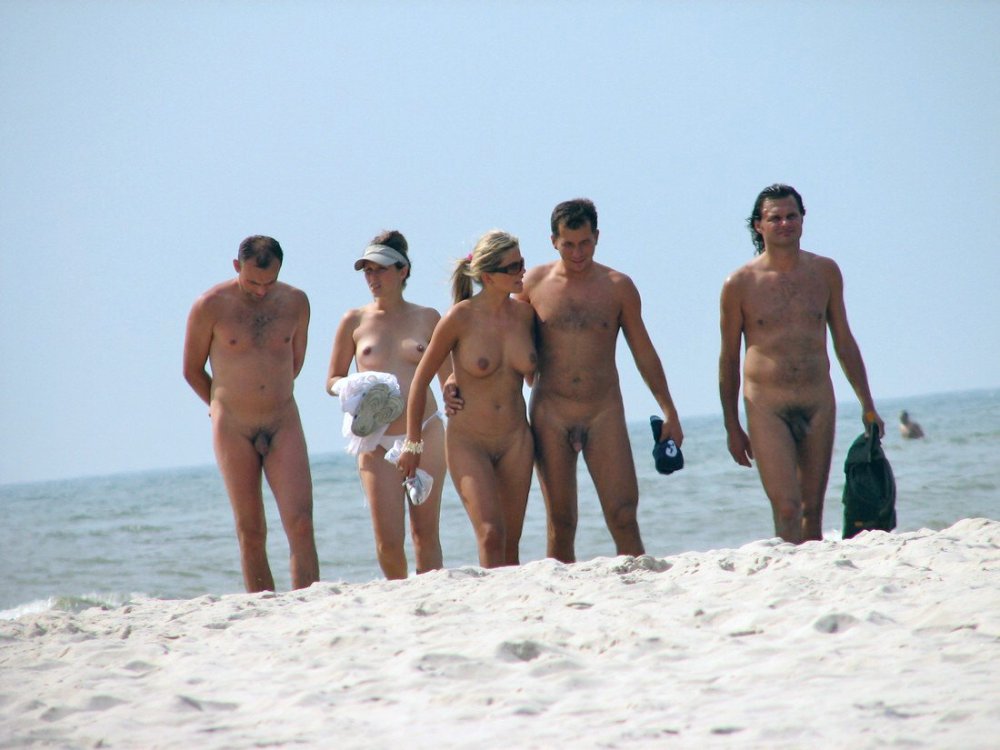 Naked men and women on the beach