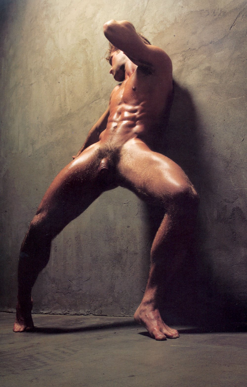 Naked guy by a naked tree