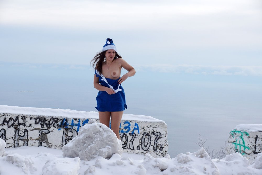 Snow Maiden in a room with a view of the mountains