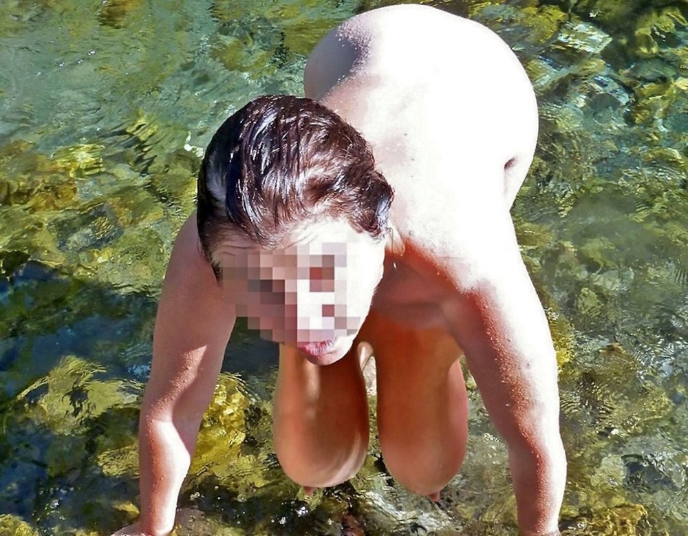 Naked old woman Wet water at sea