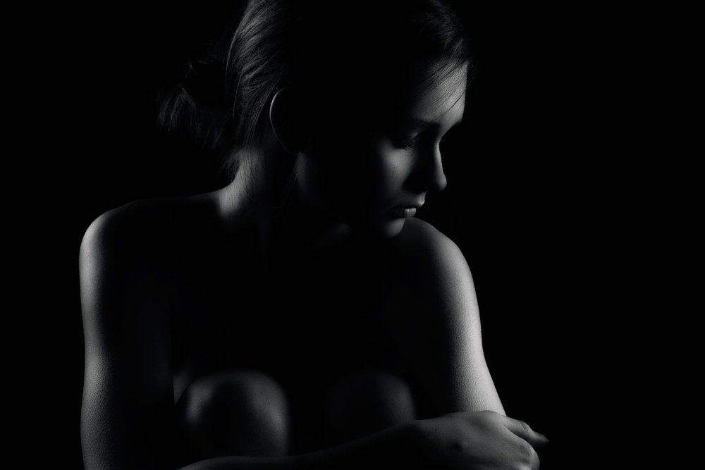 Photo shoot nude on a black background