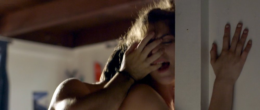Emily Shaw on the bed naked
