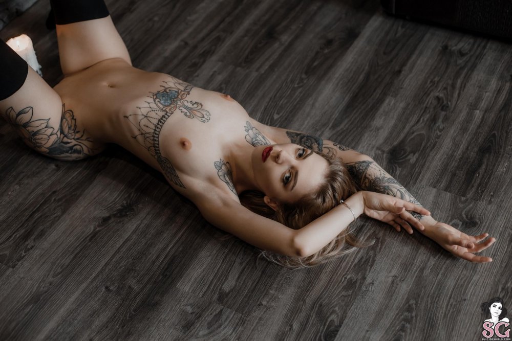 Naked red -haired women in Micca stockings