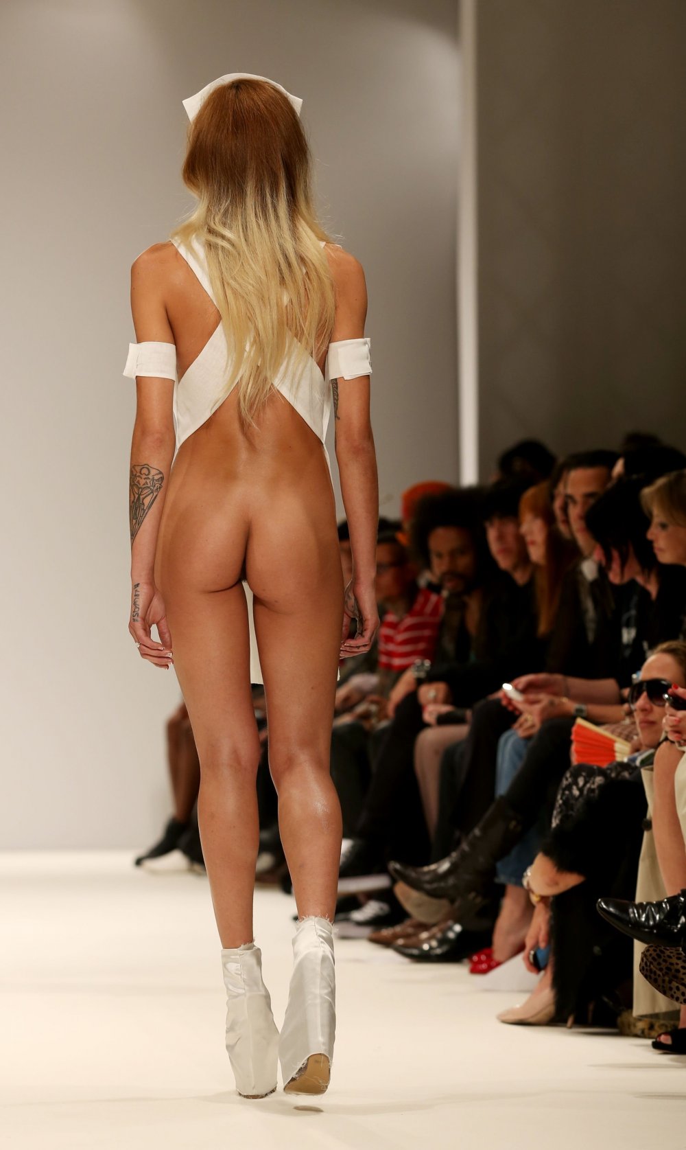 Naked fashion models on the podium