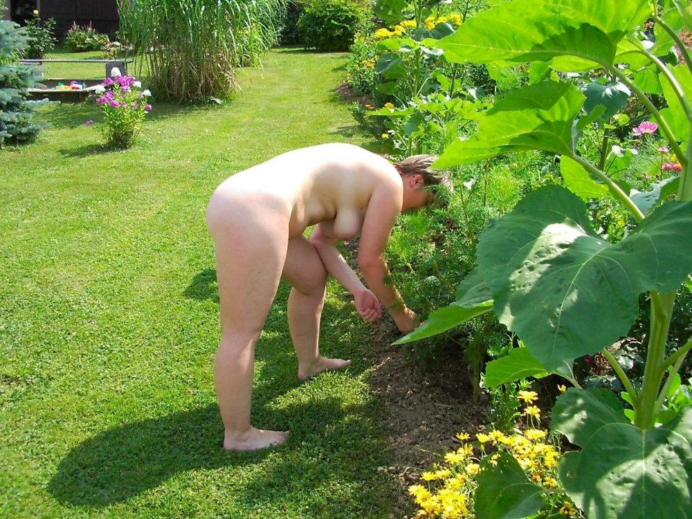 Naked women at the cottage in the garden