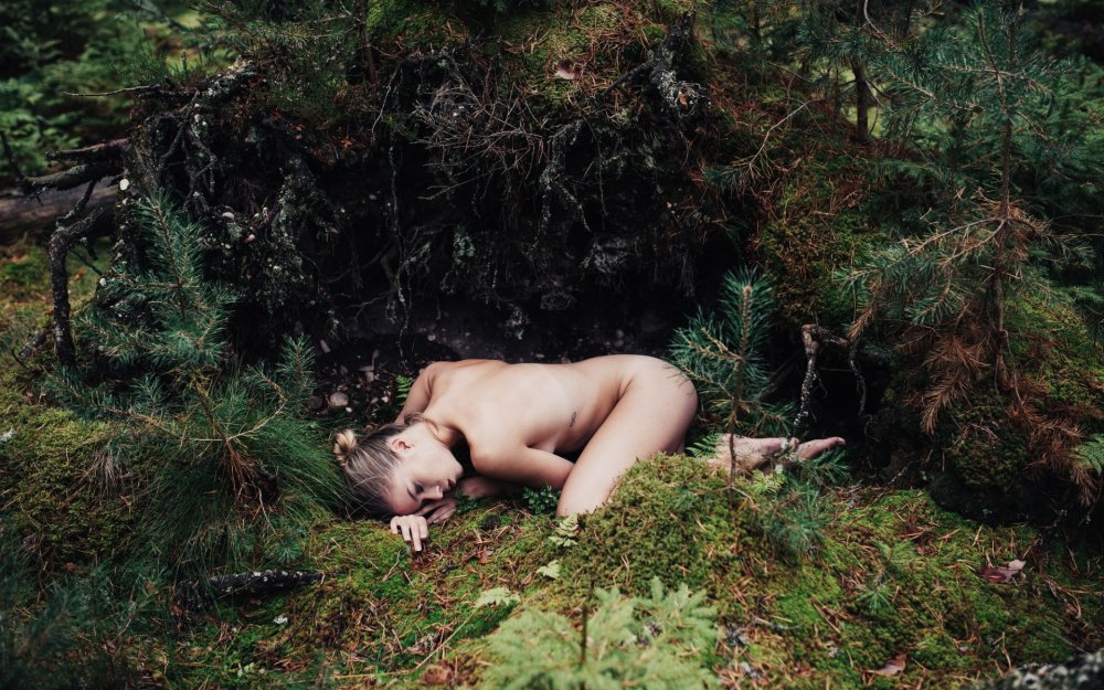 Dead naked girl in the forest