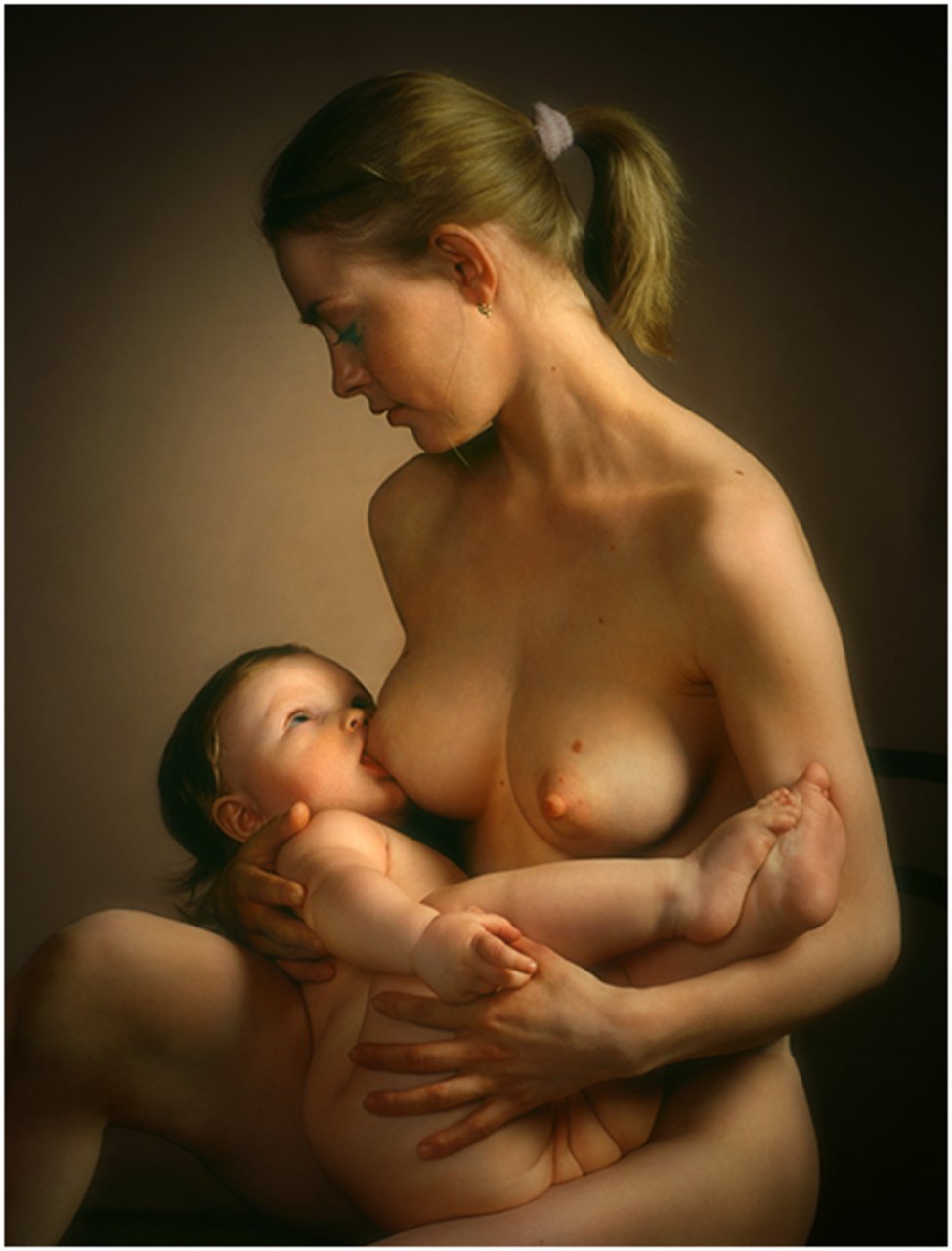 Naked woman with baby