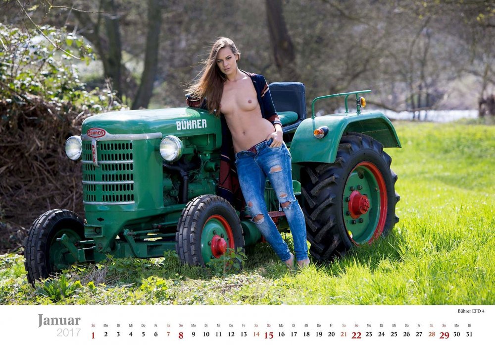 Naked against the background of the tractor