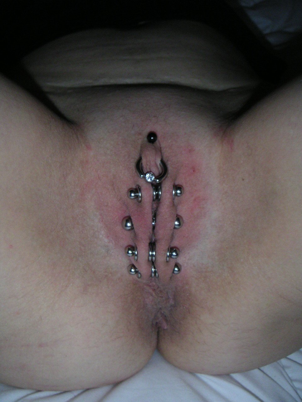 Piercing corset on sexual lips