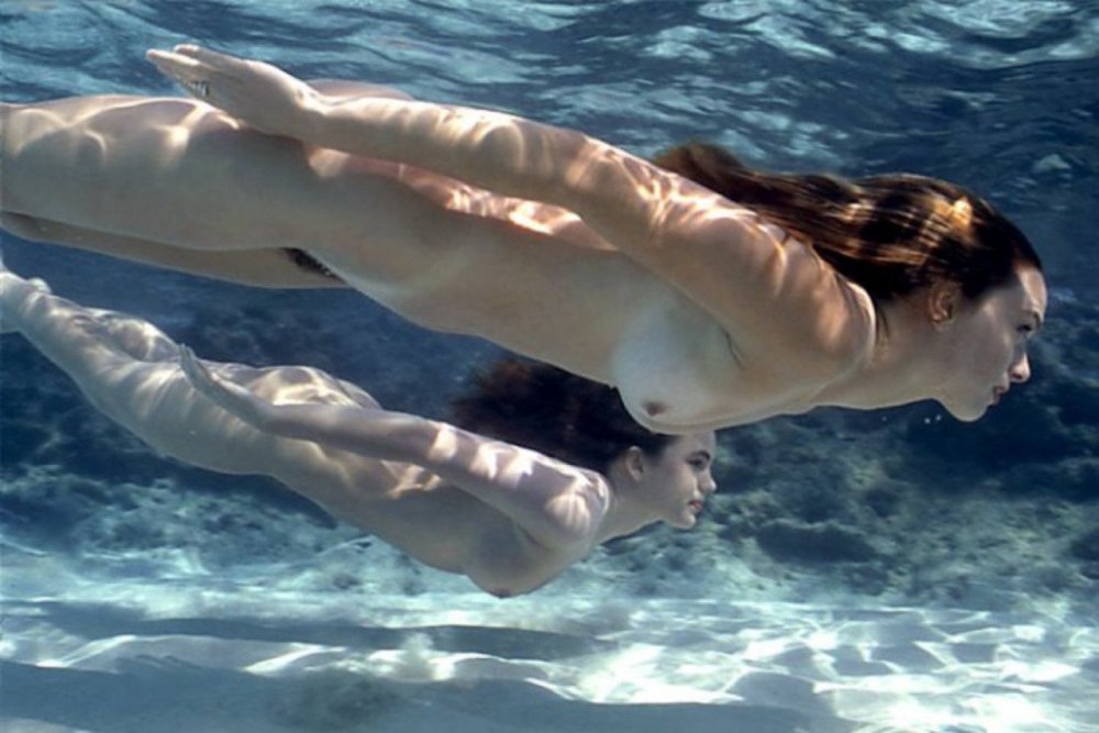 Nude woman diving
