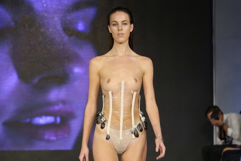 Fashionable showing with bare breasts