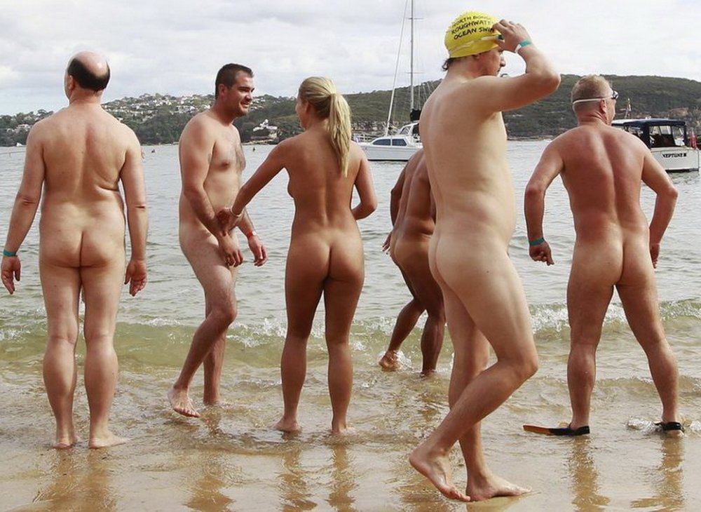 Crowd of naked people on the beach
