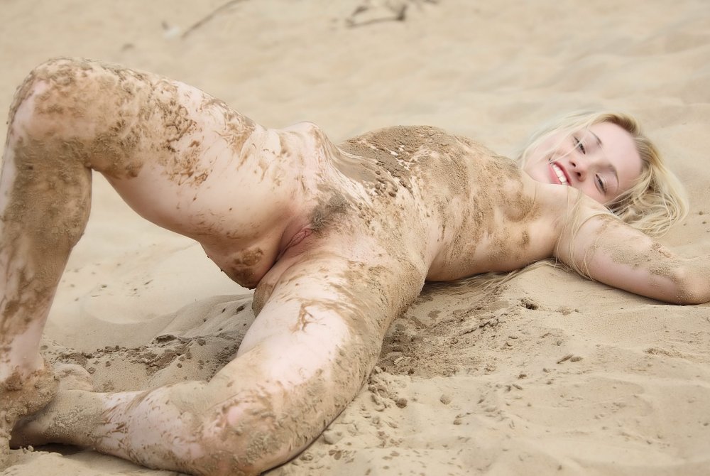 The naked girl in the mud