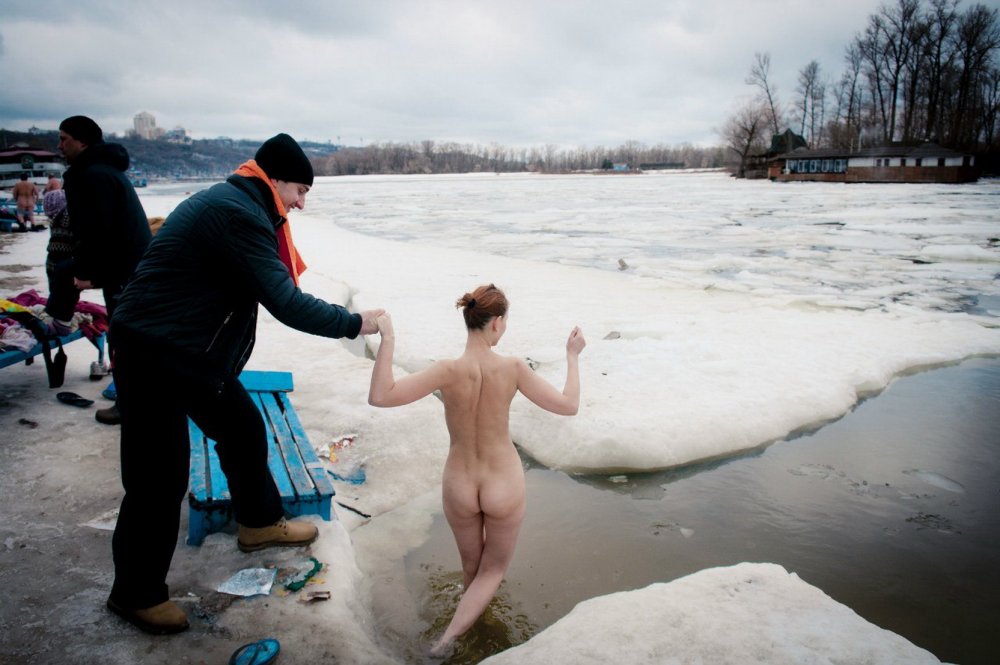 Naked guys bathe in the hole