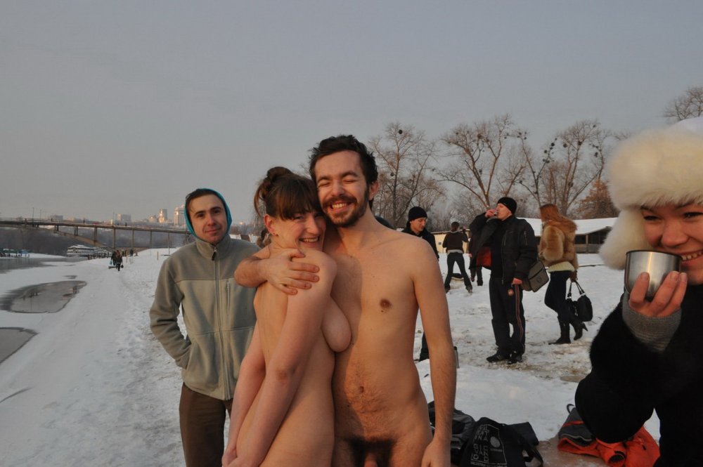 Guys bathe in a hole naked
