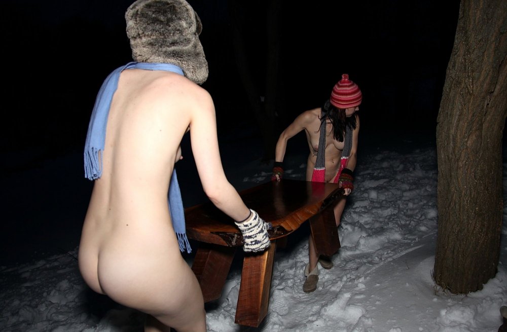 Naked men in the snow bathe
