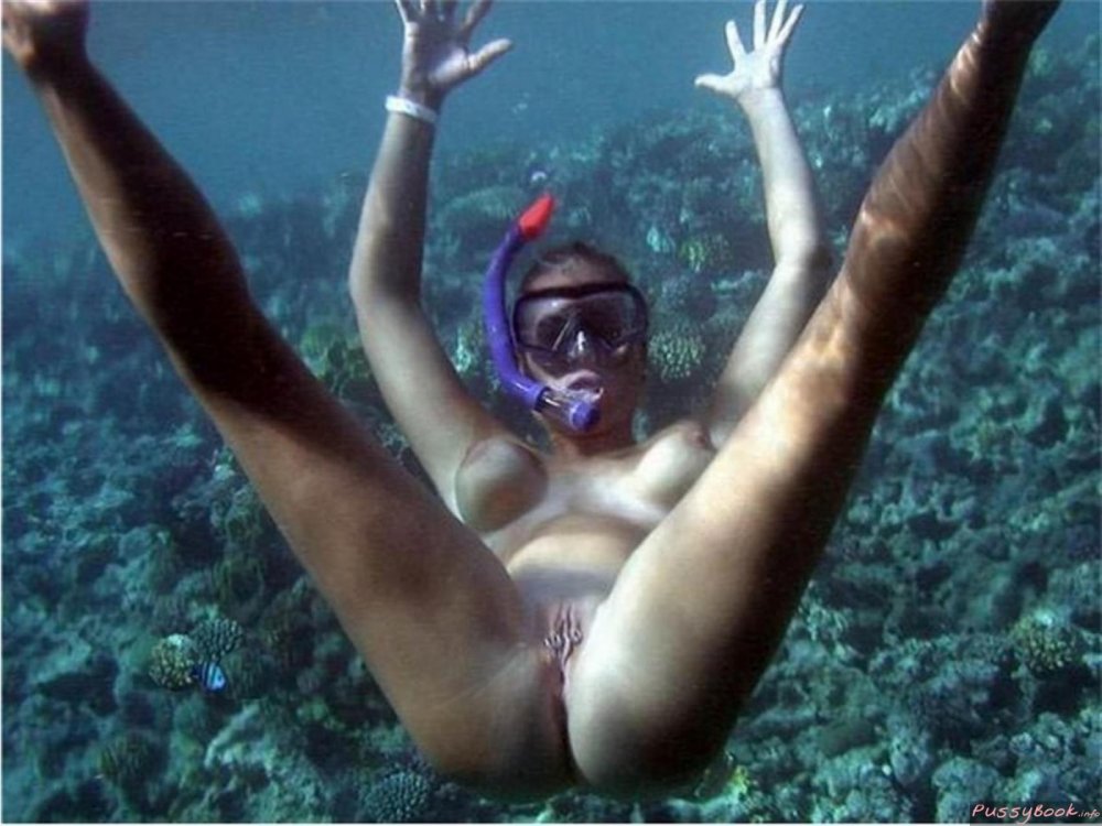 Naked women jump into the water