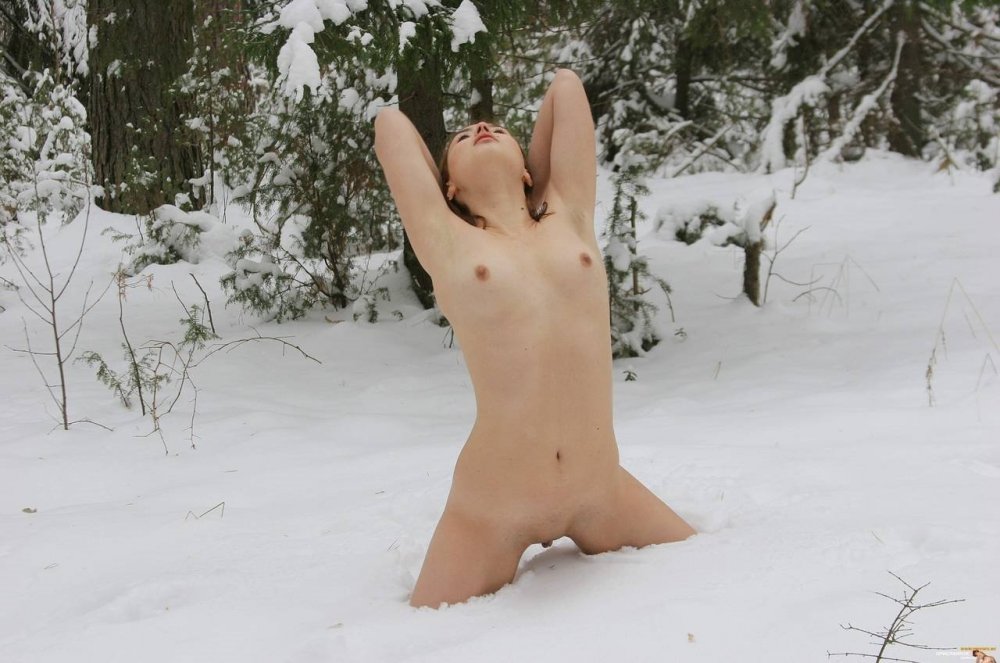 Naked women lie on the snow