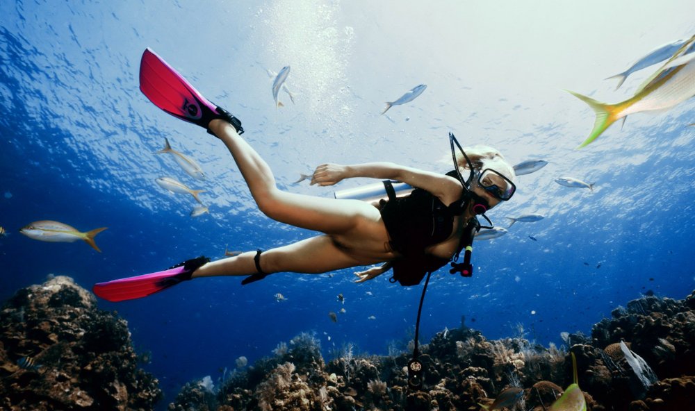 Girl under water diving