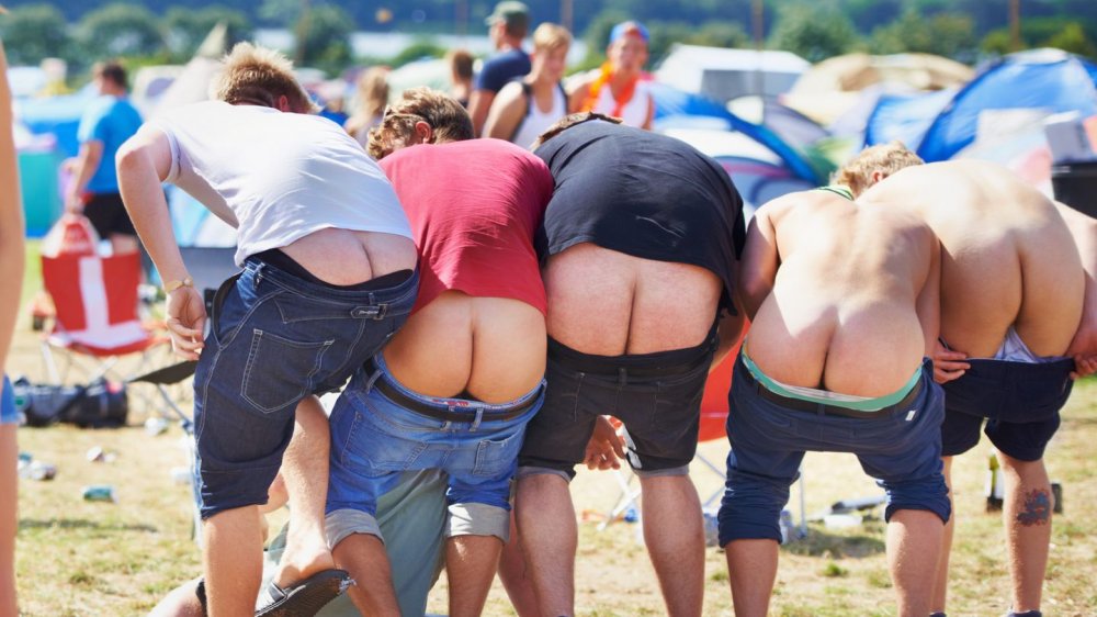 Mooning gesturing buttocks