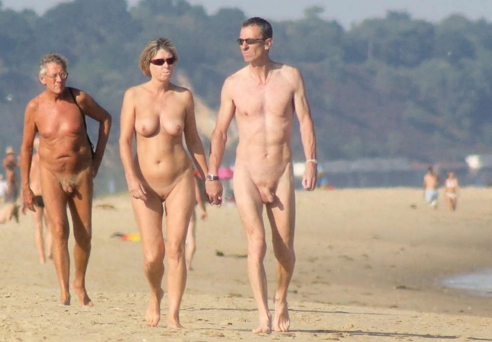 Naked sexy couple on the beach