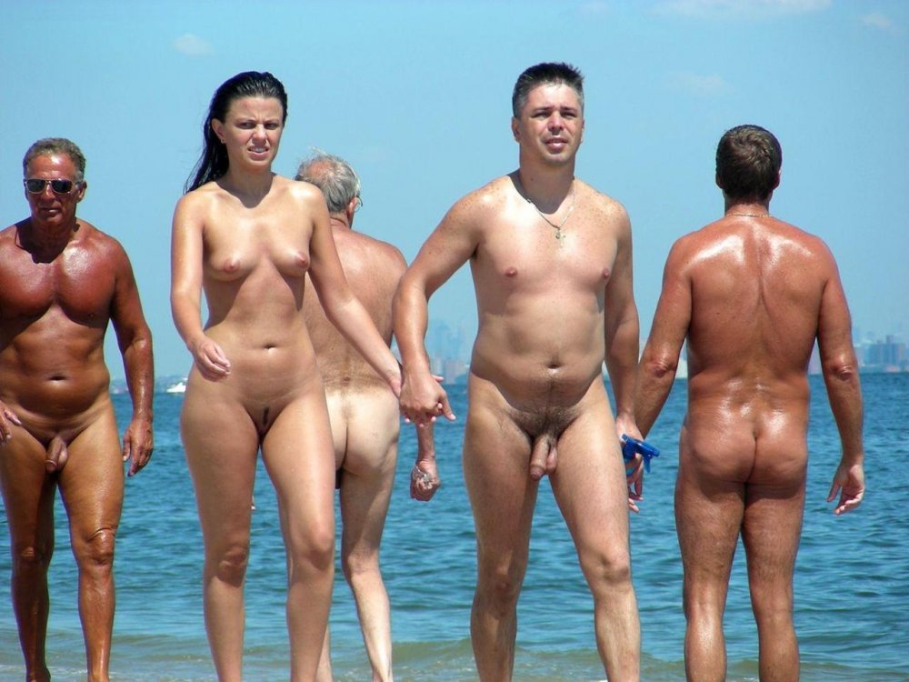 Naked couple with erection on the beach