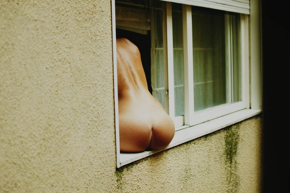 Pops near the window naked