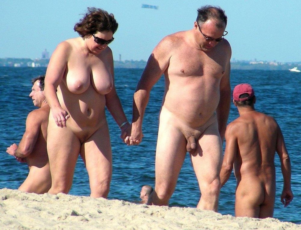 Naked mature couples on the beach