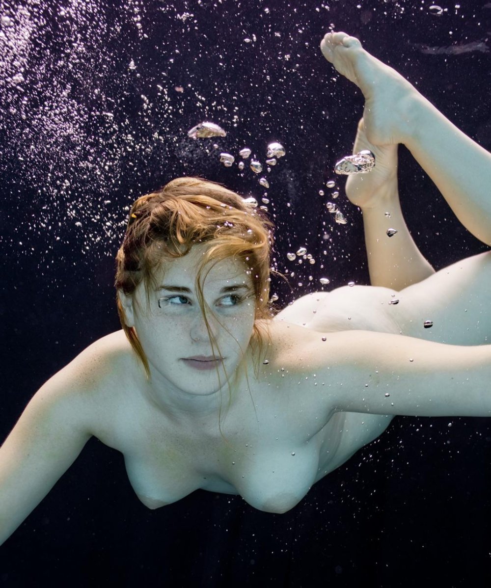Naked synchronist in water