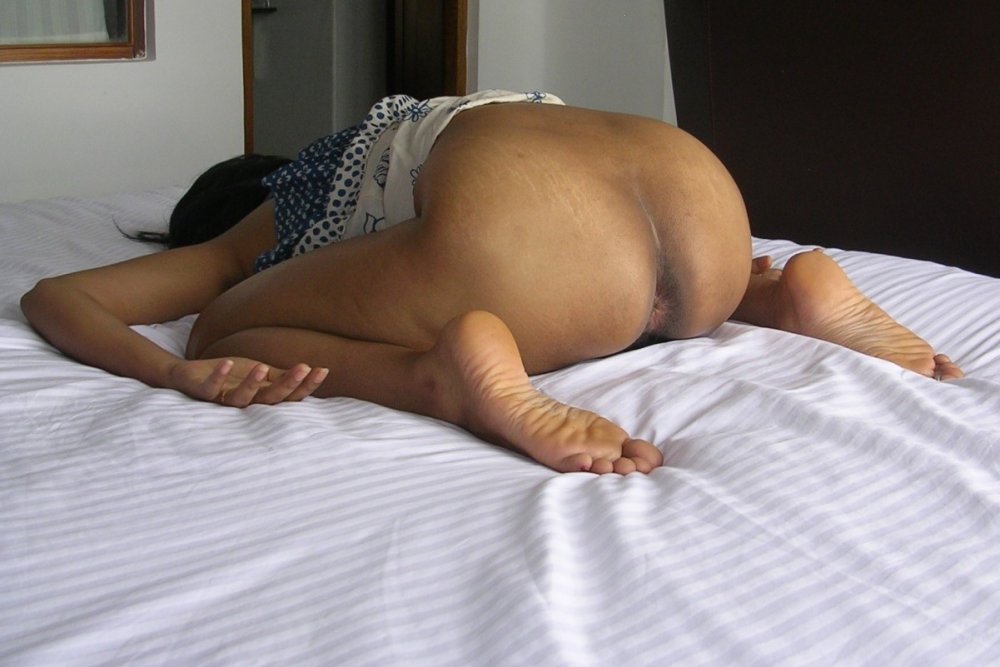 Nude Woman Spread Her Legs On The Bedroom