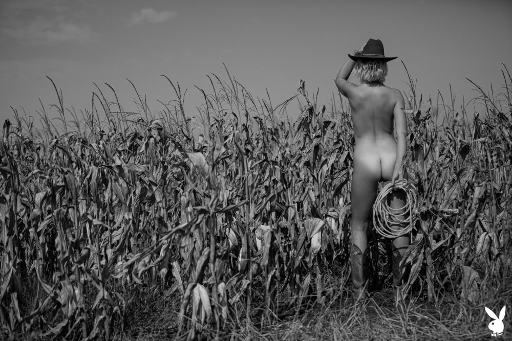 Naked in a green leather chair