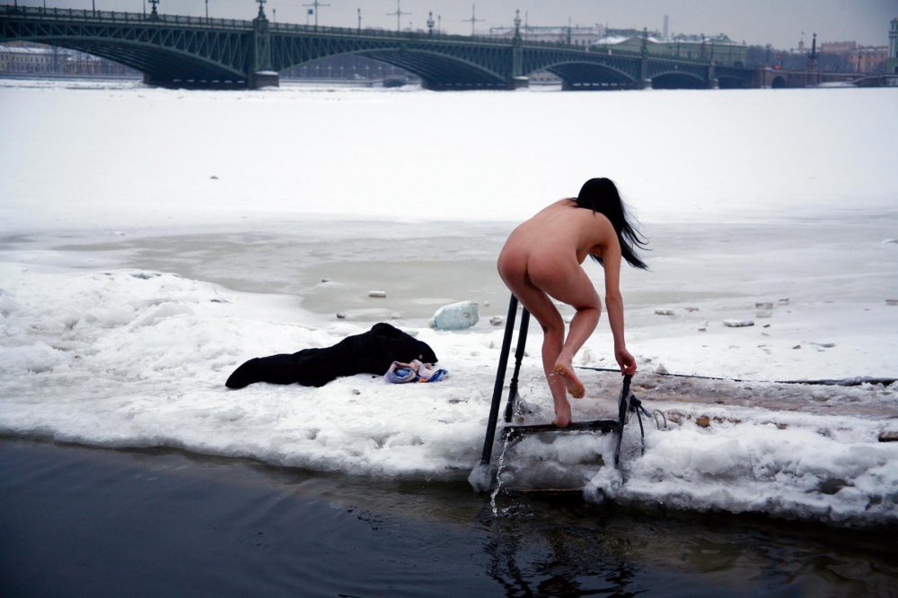 Naked girls bathing in an ice-hole