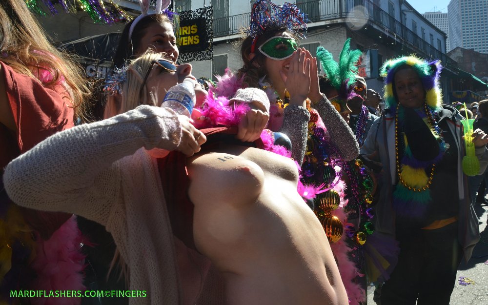 Girl shows her breasts in public