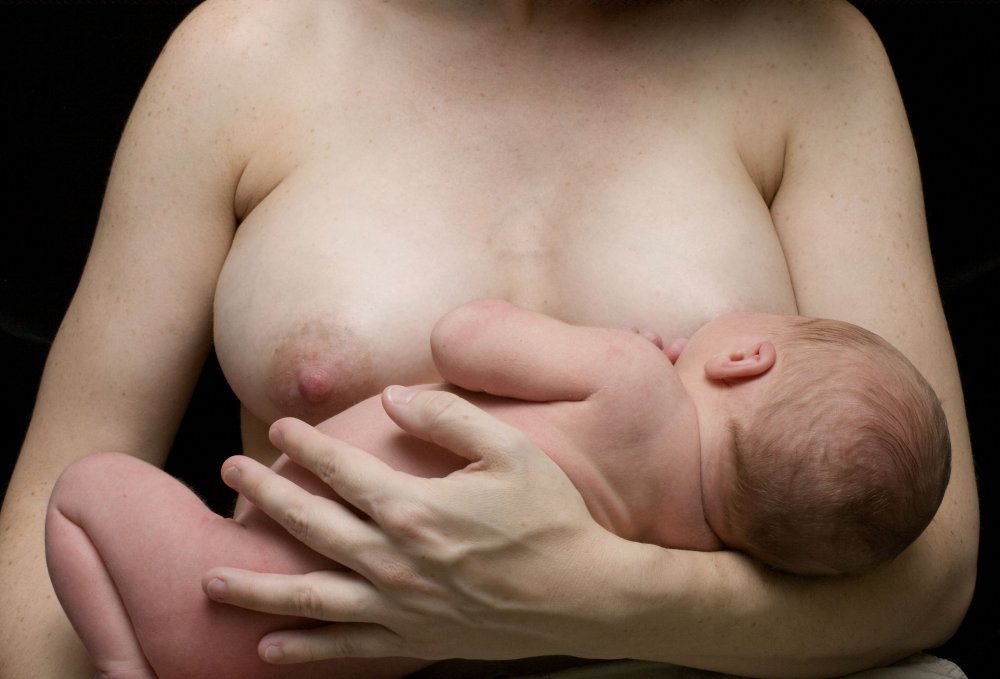 Naked women breastfeeding