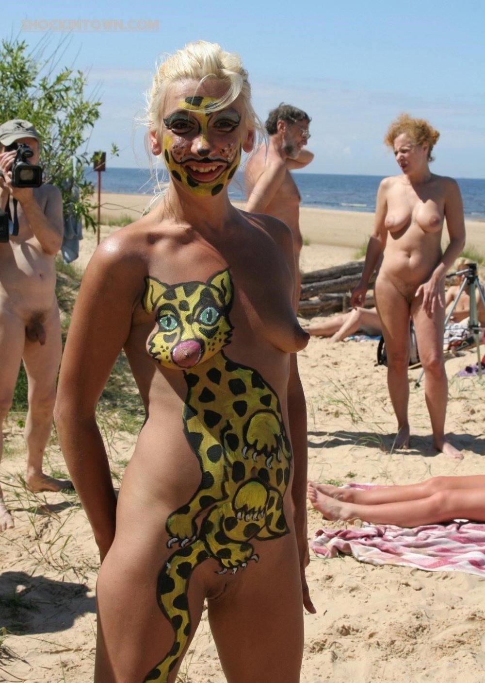 Body art on a nudist beach