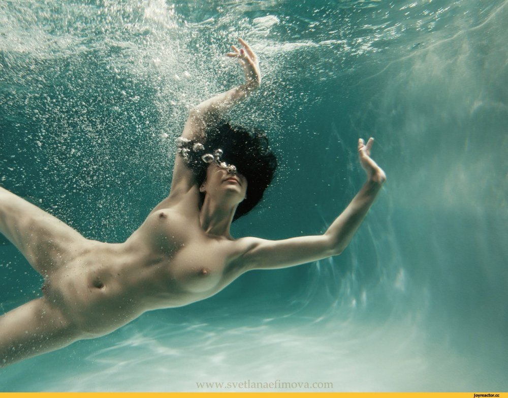 Naked athletes in water