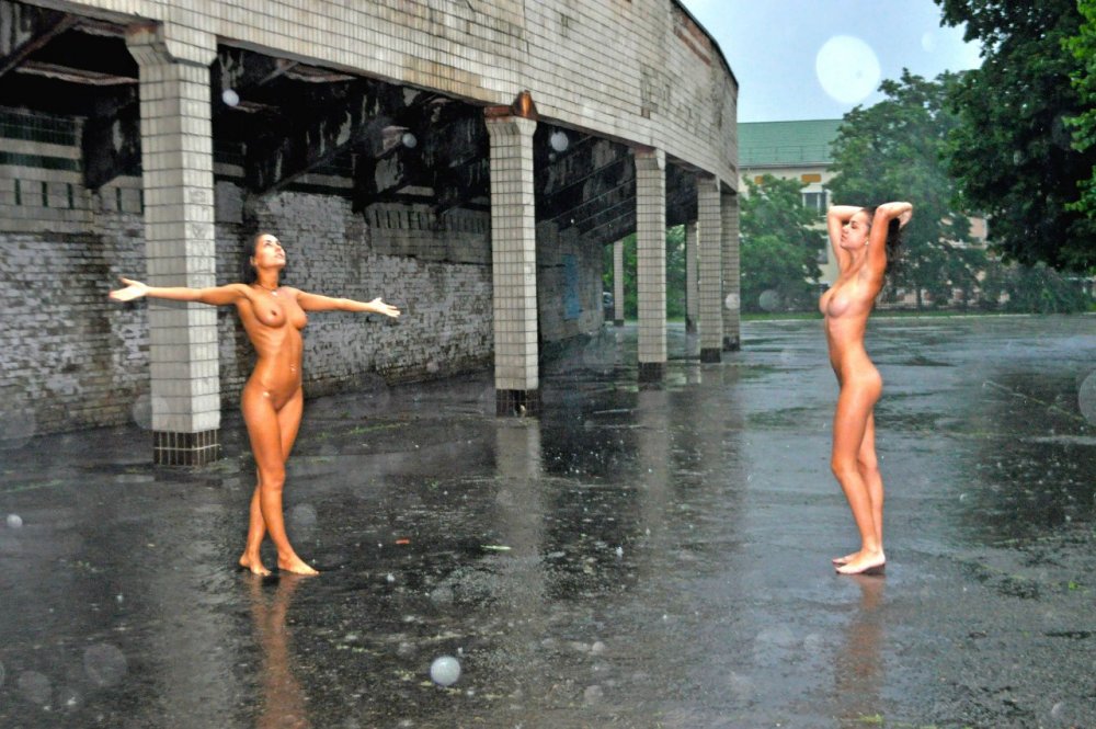 Naked women in the rain