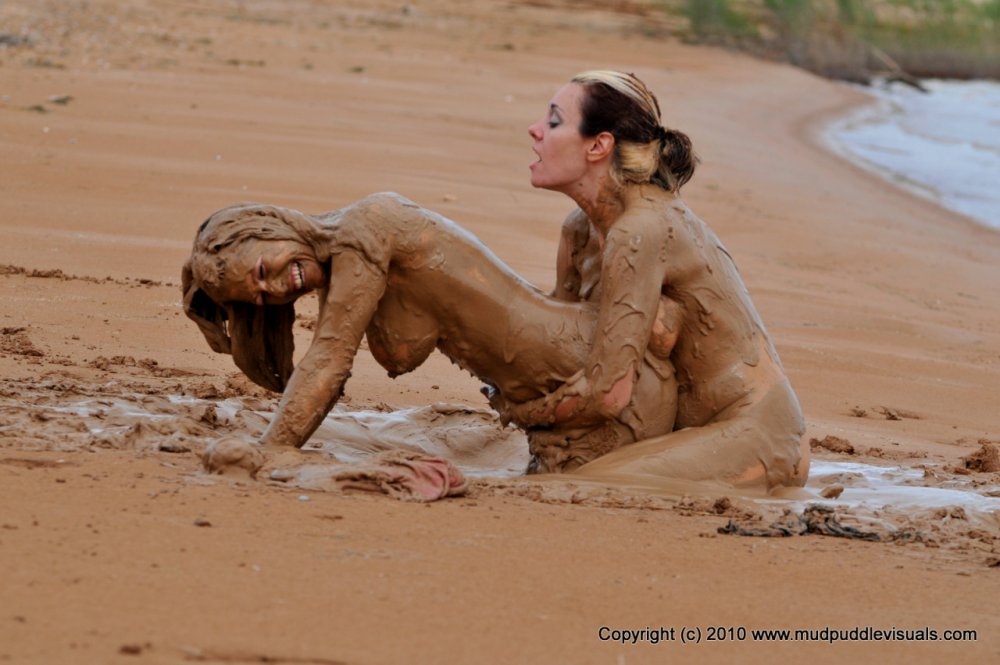 Naked women bathe in the mud