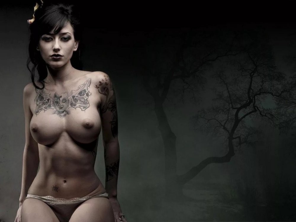 Tattoo on naked female breast